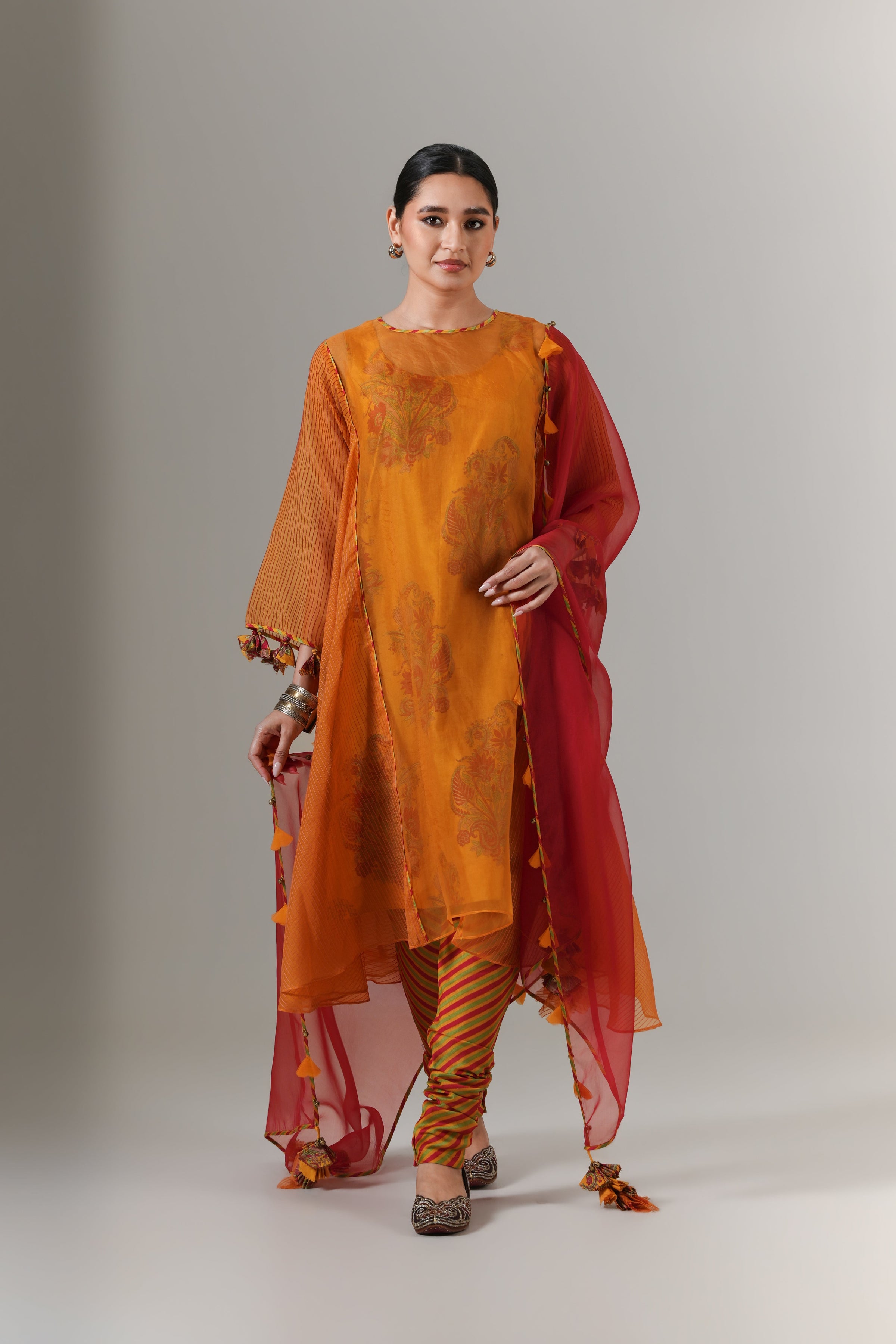 Organza quilted kali kurta with paisley buta chanderi slip, churidar and dupatta.