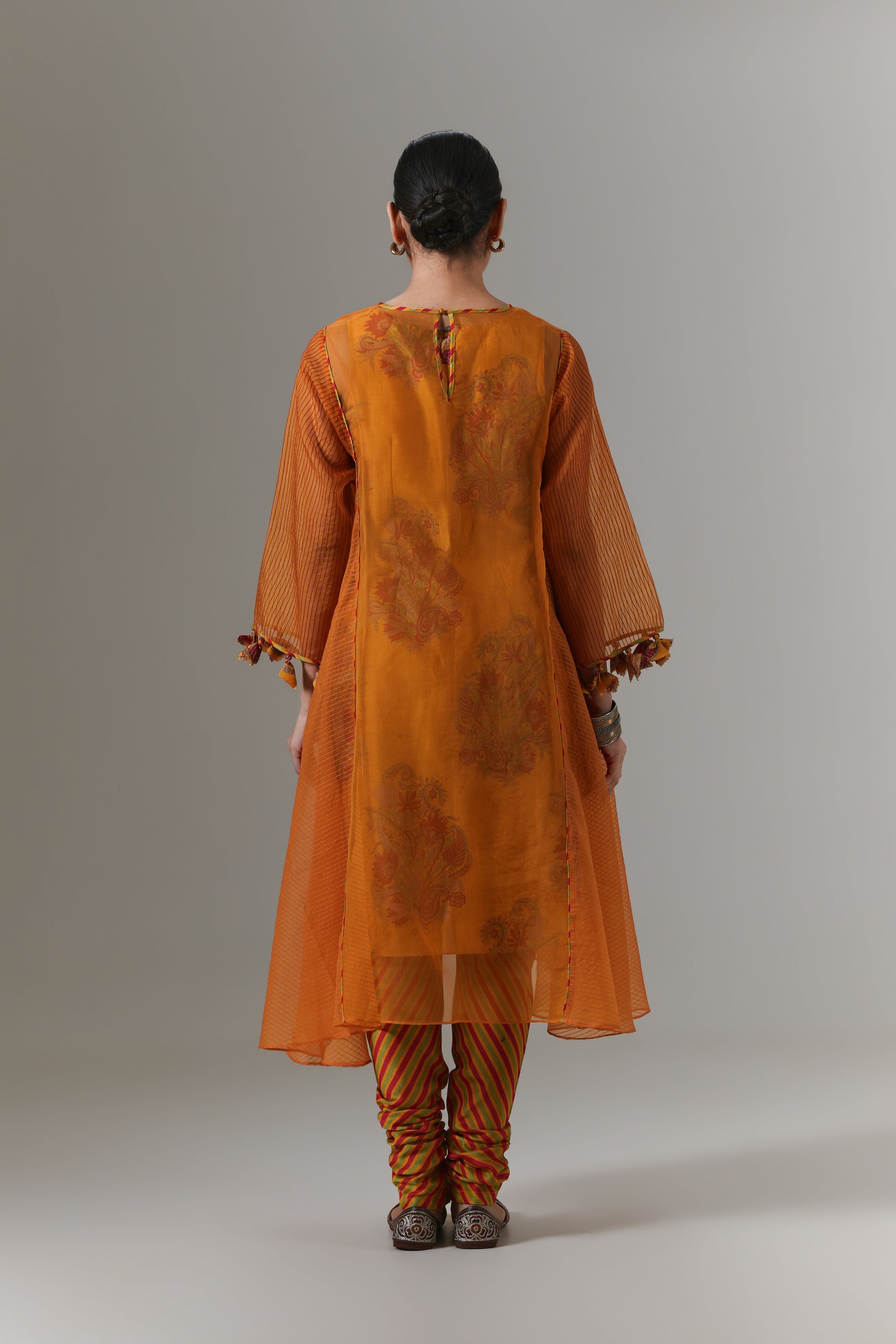 Organza quilted kali kurta with paisley buta chanderi slip, churidar and dupatta.