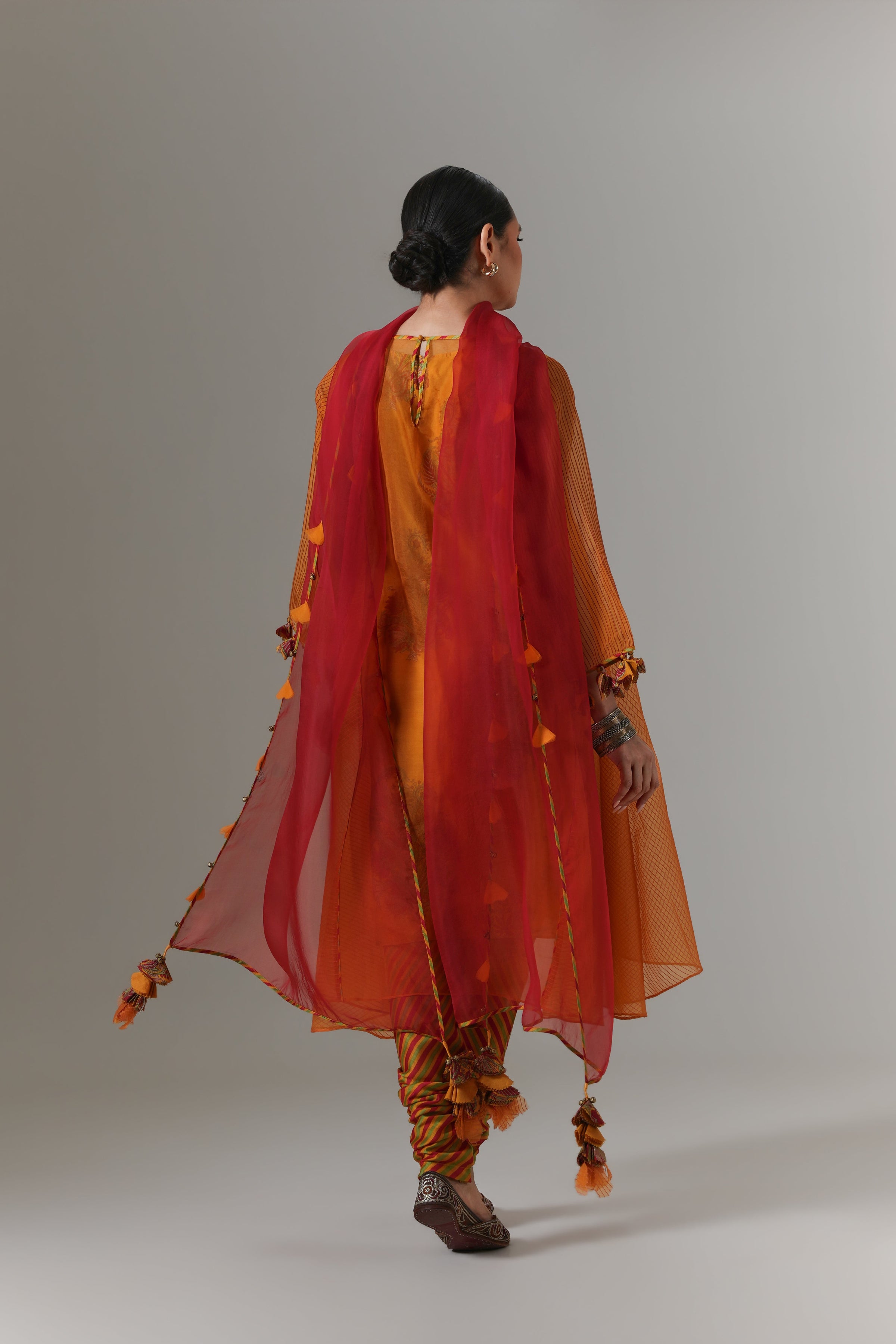 Organza quilted kali kurta with paisley buta chanderi slip, churidar and dupatta.