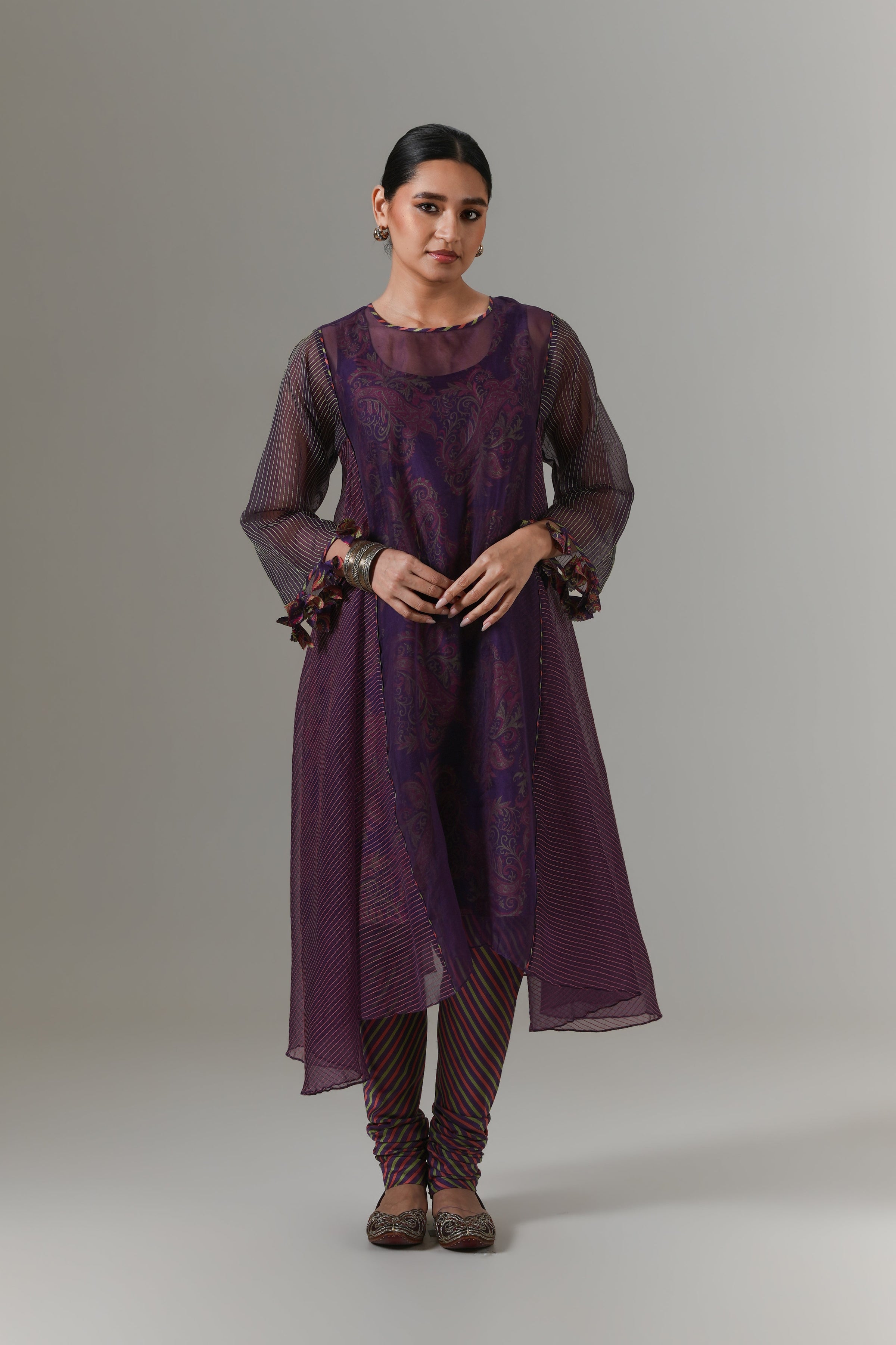 Organza quilted kali kurta with all-over paisley chanderi slip, churidar and dupatta.