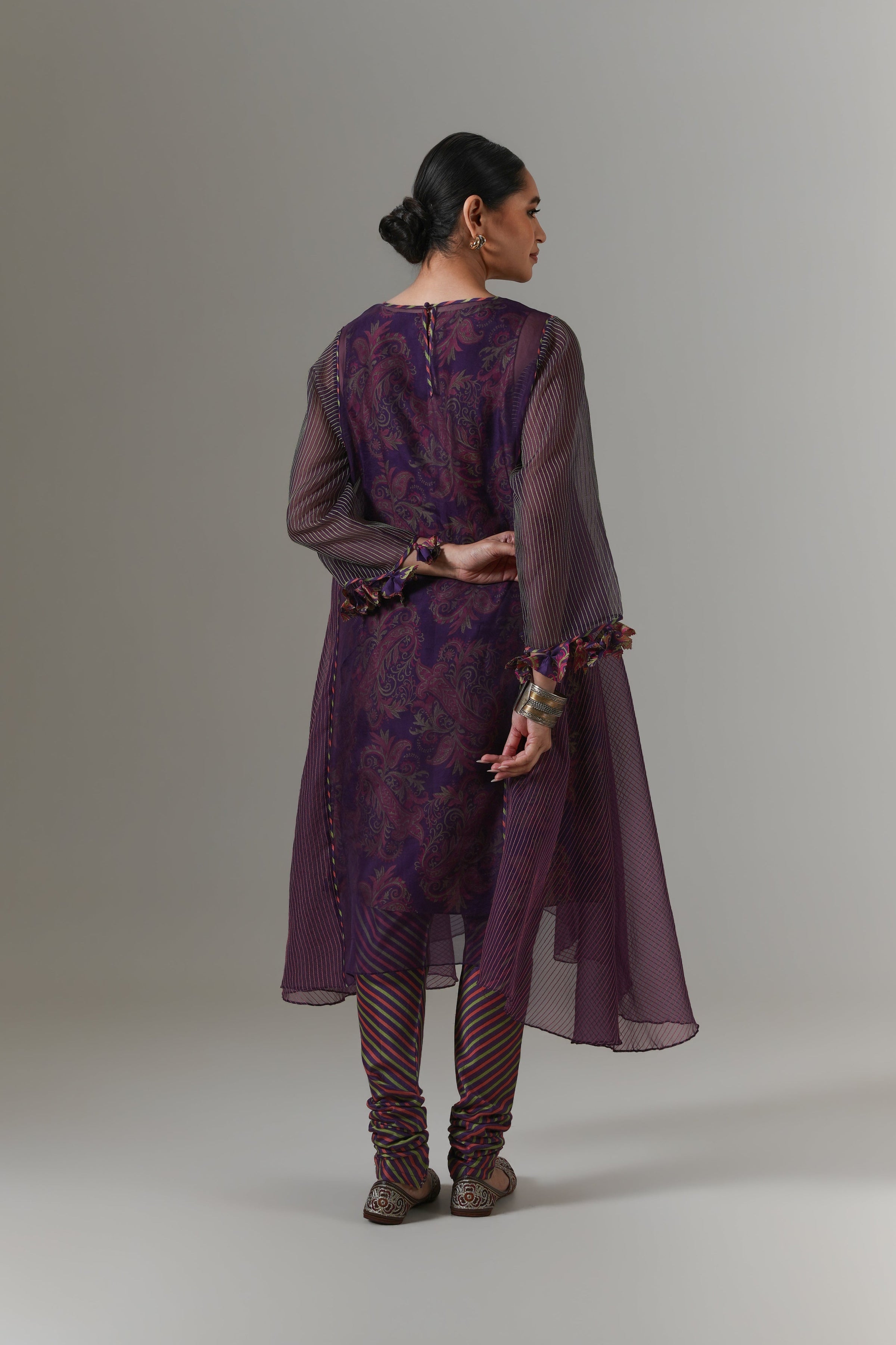 Organza quilted kali kurta with all-over paisley chanderi slip, churidar and dupatta.