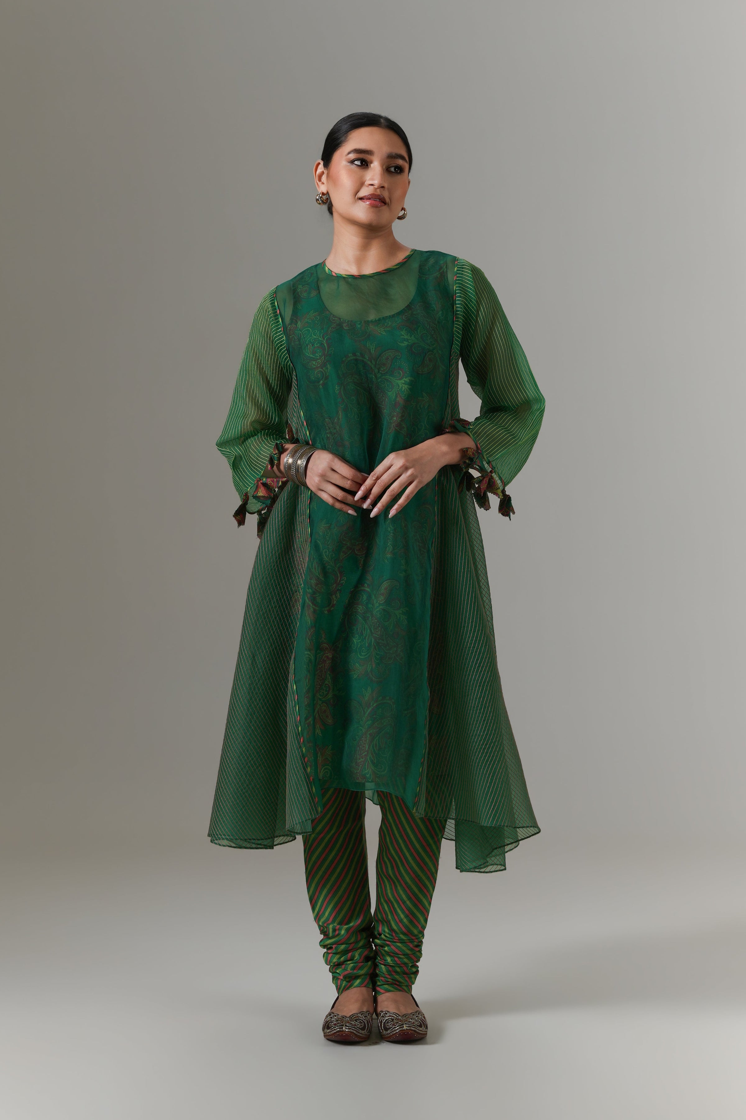 Organza quilted kali kurta with all-over paisley chanderi slip, churidar and dupatta.