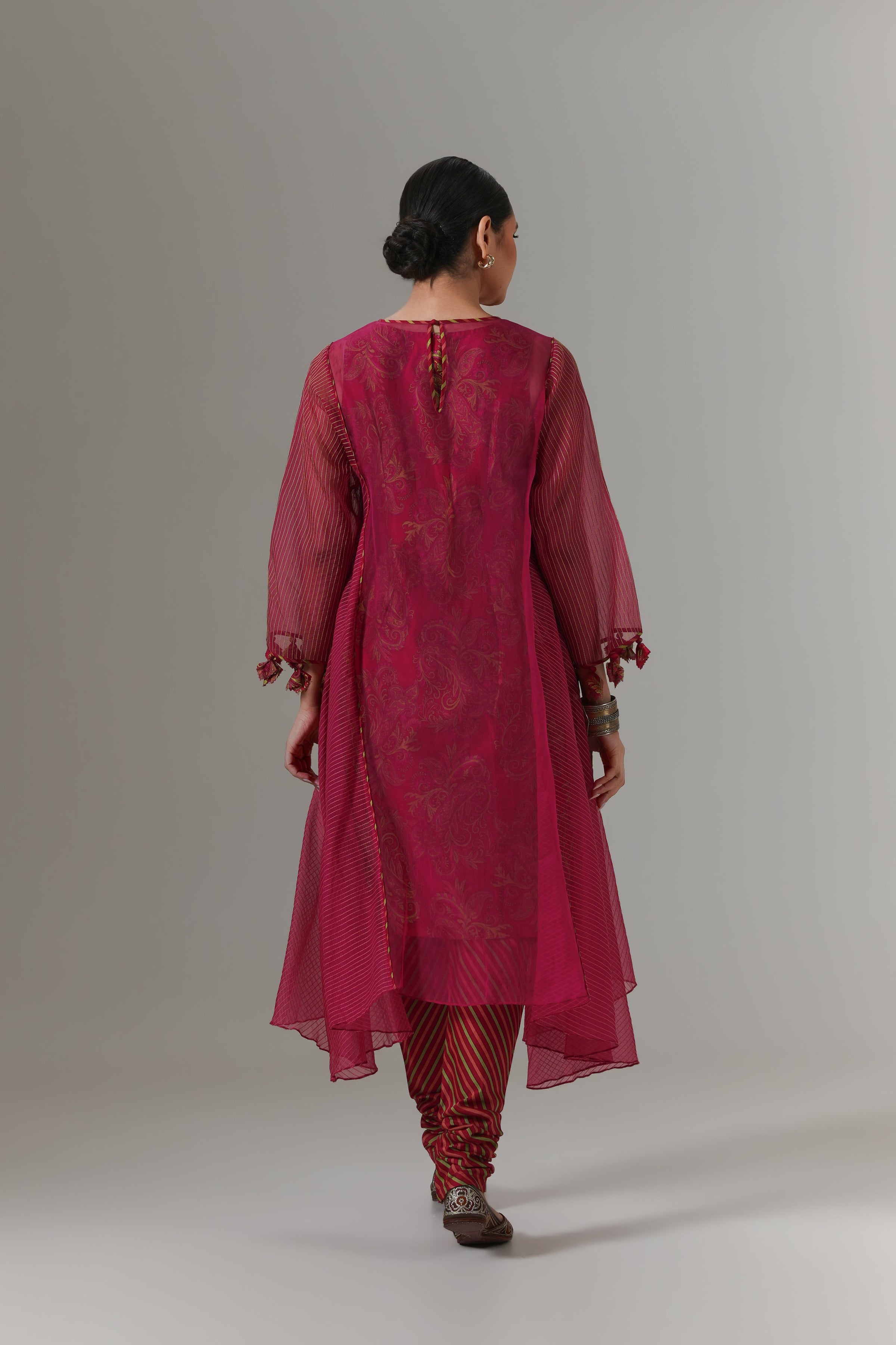 Organza quilted kali kurta with all-over paisley chanderi slip, churidar and dupatta.