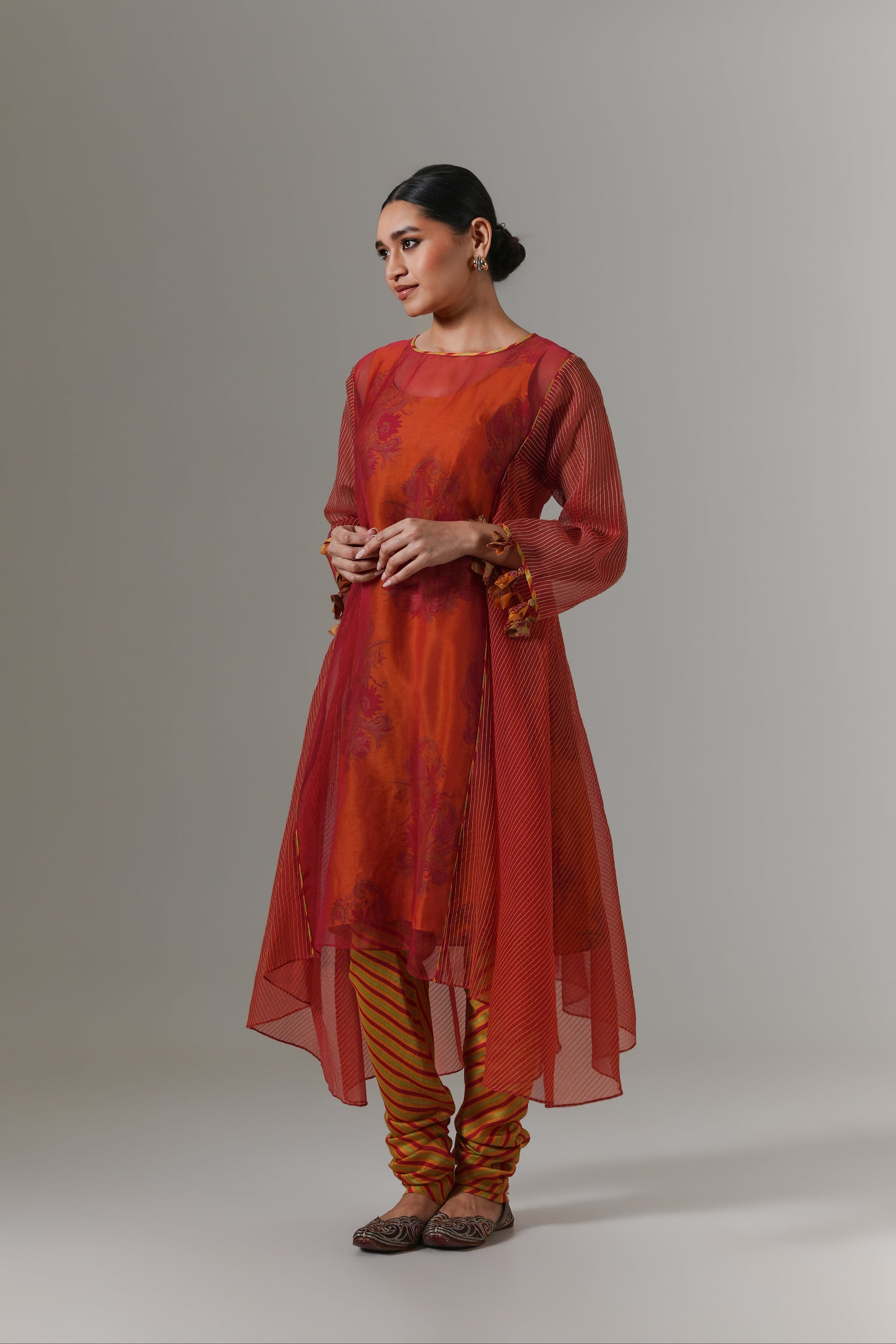 Organza quilted kali kurta with paisley buta chanderi slip, churidar and dupatta.
