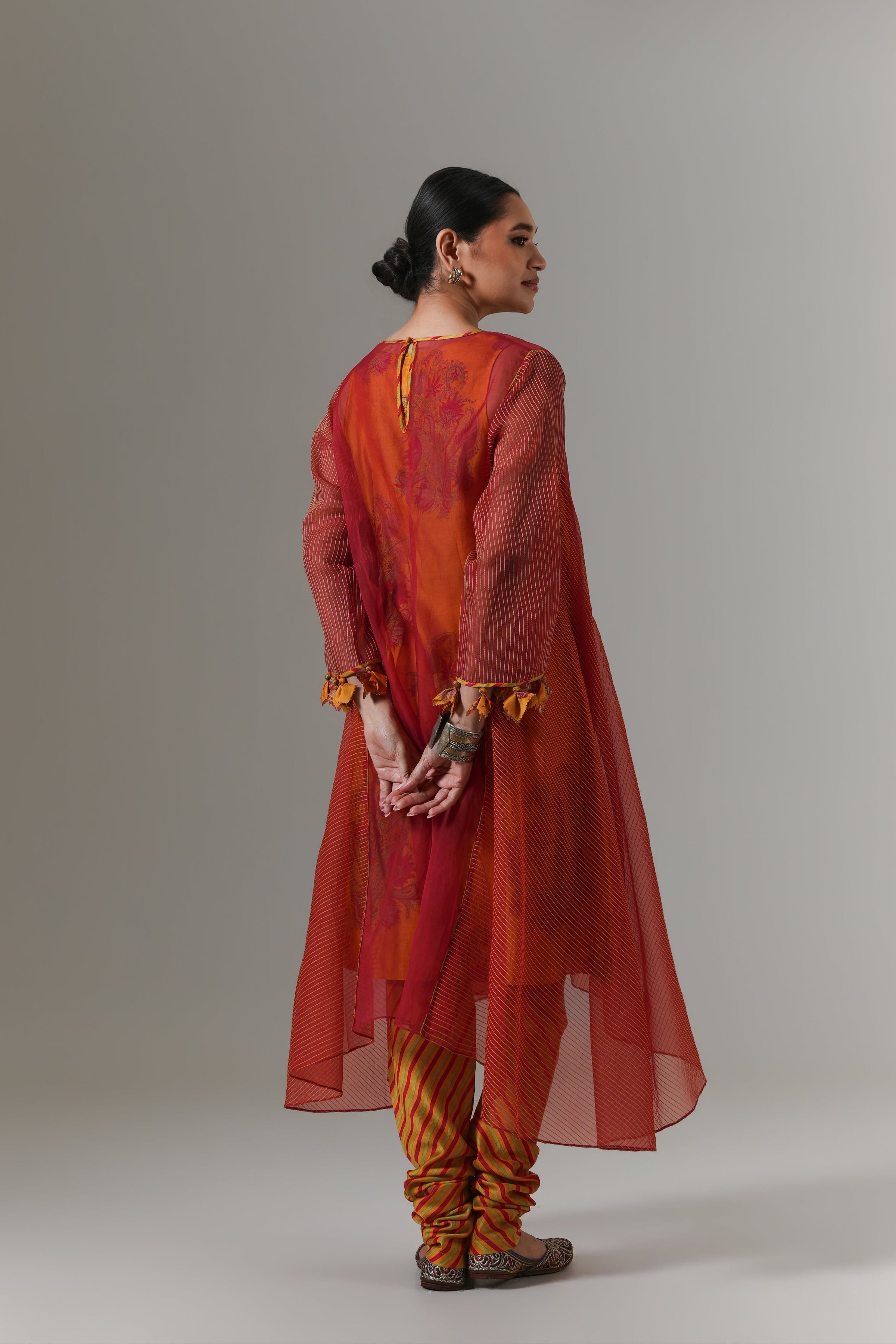 Organza quilted kali kurta with paisley buta chanderi slip, churidar and dupatta.