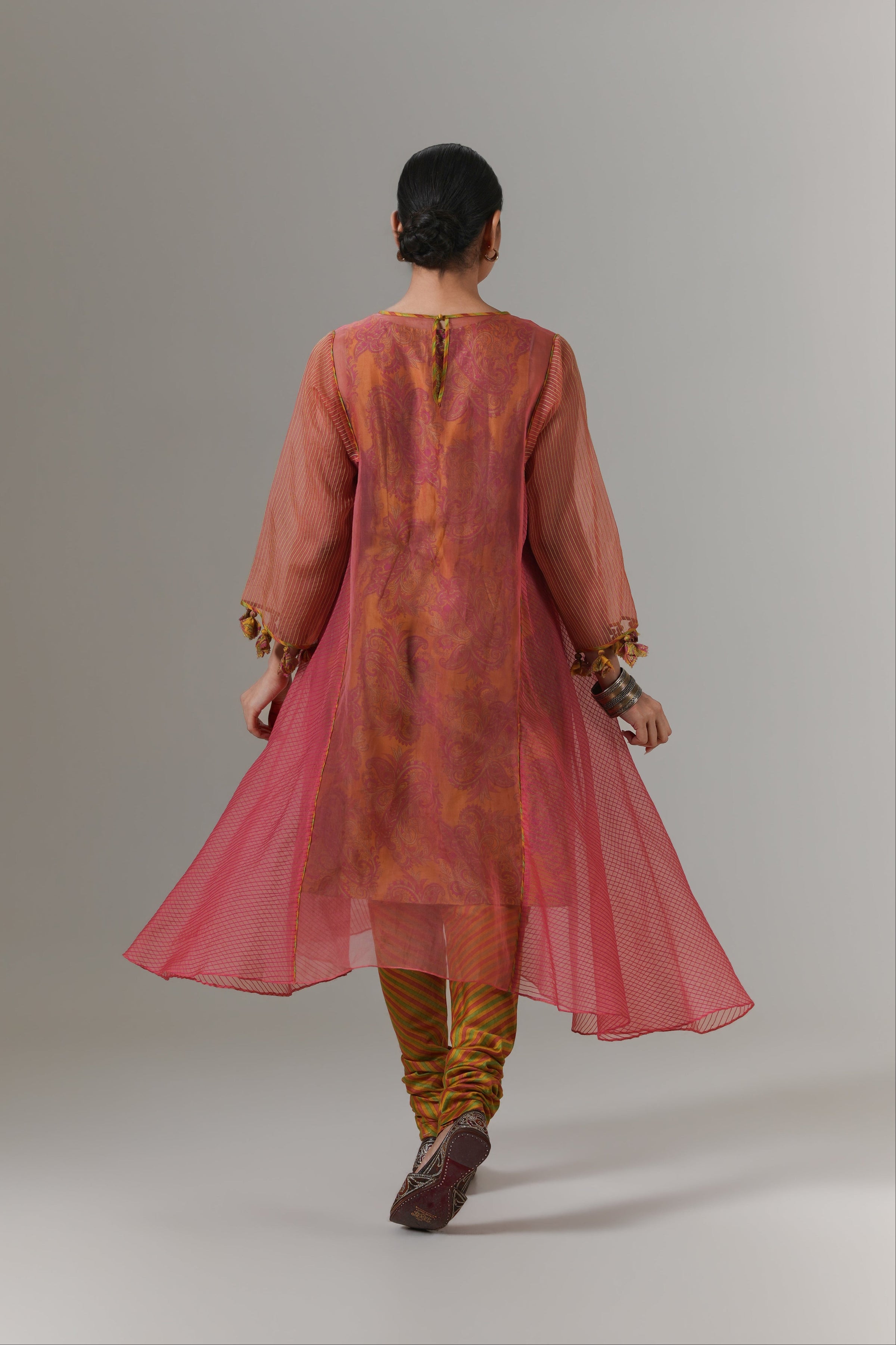 Organza quilted kali kurta with all-over paisley chanderi slip, churidar and dupatta.